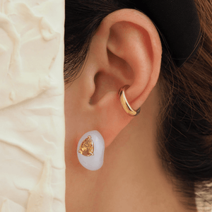 Earring | jingyayi | an elegant lady wearing crisp sharp pear shaped vibrant champagne color diamond on sumptuously smooth texture and translucent carved white jade earring.