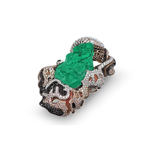 Hand-crafted uncut natural Columbian emerald showcasing its naturally vibrant green color that is striking against the black and white diamonds. Accompanied by white jadeite stones, this sparkling ensemble is encrusted onto the enamel and solid white gold base.  by Jingyayi