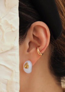 An elegant female wearing a velvety translucent natural White Jade Earring with crisp Champagne color Pear Shaped Diamond, handmade by www.jingyayi.com 